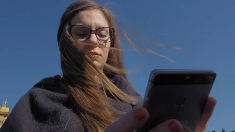 Young woman using smartphone Stock Footage 74308167