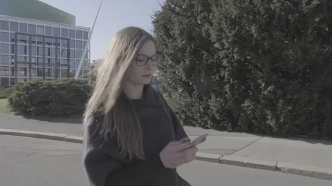 Young woman using smartphone Stock Footage 74341393