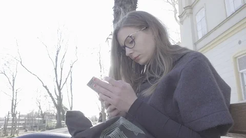 Young woman using smartphone Stock Footage 74342702