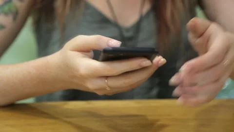Young woman is using smartphone. Stock Footage 92368791
