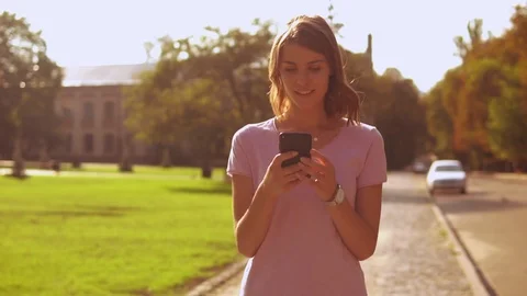 Young woman using smartphone Stock Footage 98484709