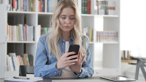 Young Woman Using Smartphone Video stock 104014231
