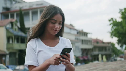 Young woman using smartphone Stock Footage 154642845