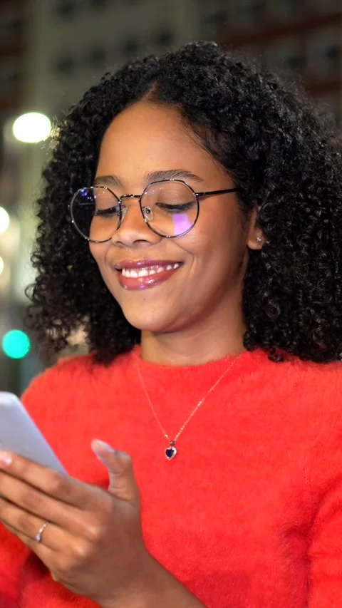 Young woman using smartphone at night Stock Footage 297910145