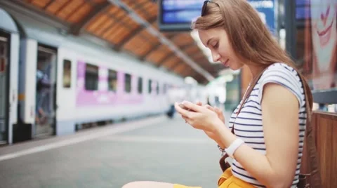 Young Woman Using Smartphone at Train Station. Slow motion 120 fps Stock-Footage 68544767