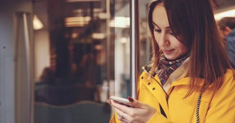 Young Woman Using Smartphone on a Train. SLOW MOTION 4K. Vidéo 140295044