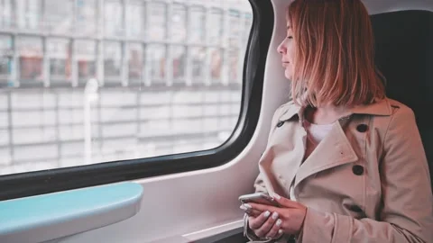 Young Woman Using Smartphone on a Train, technology, daily commute. SLOW MOTION 스톡 동영상 140368581