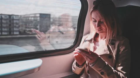 Young Woman Using Smartphone on a Train, technology, daily commute. SLOW MOTION 스톡 동영상 140368591