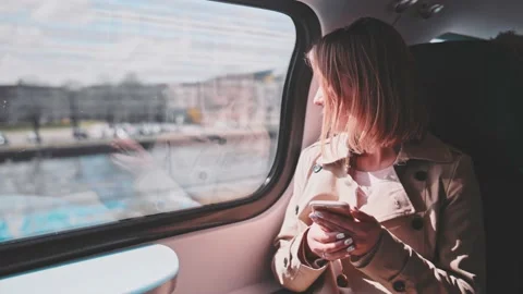 Young Woman Using Smartphone on a Train, technology, daily commute. SLOW MOTION 스톡 동영상 140368600