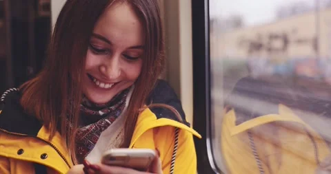 Young Woman Using Smartphone on a Train. SLOW MOTION 4K. 스톡 동영상 140368896