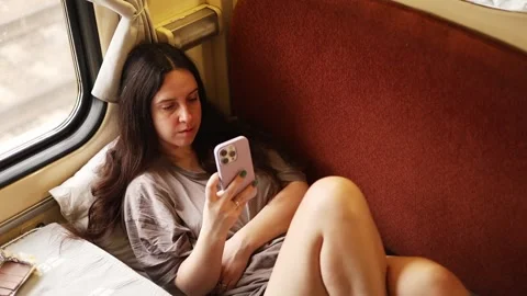 Young woman using smartphone on train Stock-Footage 308730985