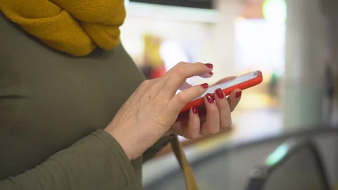 Young woman using smartphone while doing homework. Young people and college Stock Footage 124880608