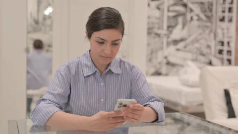 Young Woman Using Smartphone at Work Video stock 238648033