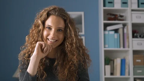 Young woman using a tablet and smiling at camera Stock Footage 89649027