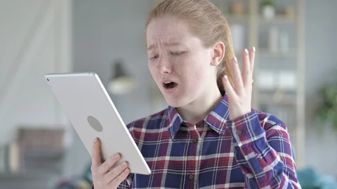 Young Woman Using tablet And being Disappointed Stock Footage 114776618