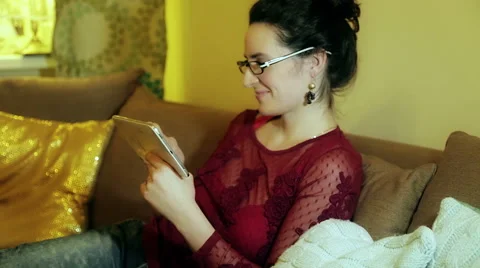 Young Woman Using Tablet Computer At Home Stock Footage 47010652