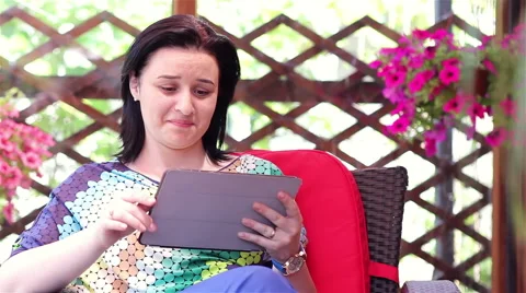 Young woman using tablet computer outside Stock Footage 50649983