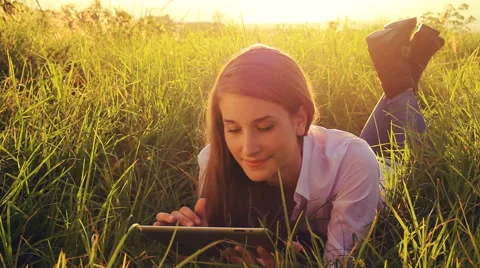 Young Woman Using Tablet Computer Touchscreen. Outdoor Healthy Lifestyle with Stock-Footage 56026003