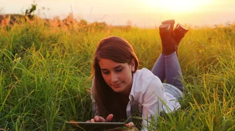 Young Woman Using Tablet Computer Touchscreen. Outdoor Healthy Lifestyle with Stock Footage 56026246