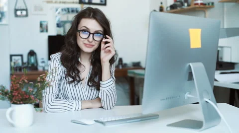 Young woman using tablet computer at office or school. look at camera Stock Footage 62766239