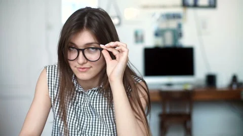 Young woman using tablet computer at office or school. look at camera Stock Footage 62849310