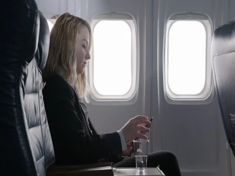 Young woman using tablet computer in first class section of aircraft 4K 스톡 동영상 69808070
