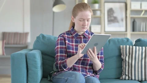 Young Woman Using Tablet Computer for Internet Stock Footage 114783804