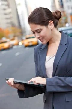 Young woman using tablet computer in new york city Stock Photos