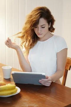 Young woman using tablet computer at home Stock Photos