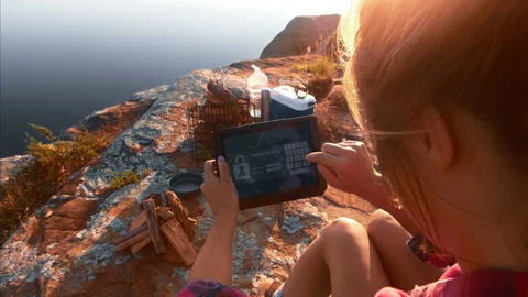Young woman using tablet device for online internet banking, sitting next to ten Stock Footage 199615722