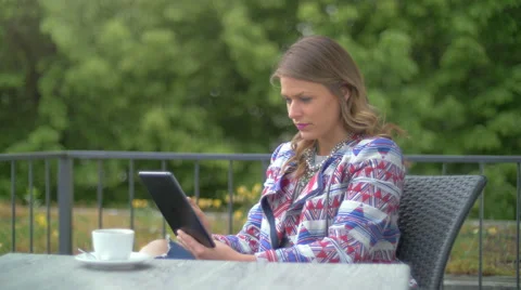 Young woman using a tablet Stock Footage 64329610