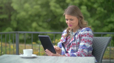 Young woman using a tablet Stock Footage 64329827