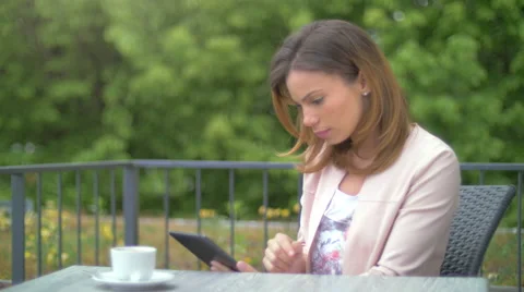 Young woman using a tablet Stock Footage 64543214