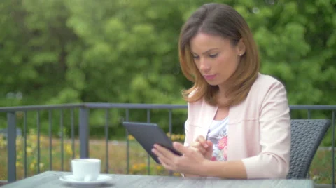 Young woman using a tablet Stock Footage 64543341