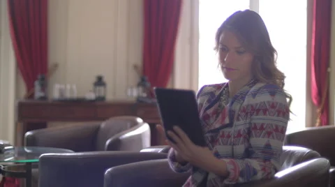 Young woman using a tablet Stock Footage 64545867
