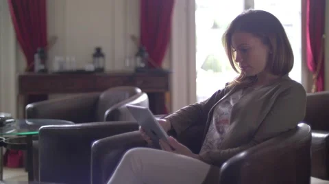 Young woman using a tablet Stock Footage 64549313