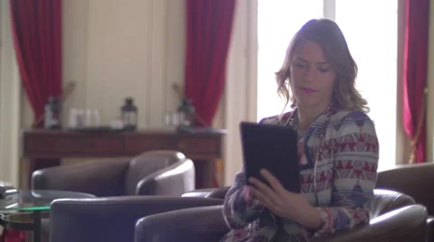 Young woman using a tablet Stock Footage 64550290
