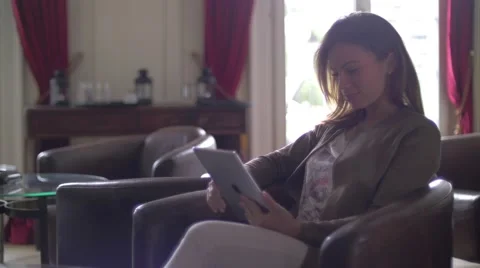 Young woman using a tablet Stock Footage 64550403