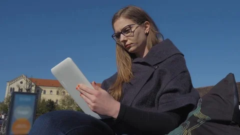 Young woman using tablet Stockbeeldmateriaal 74184532
