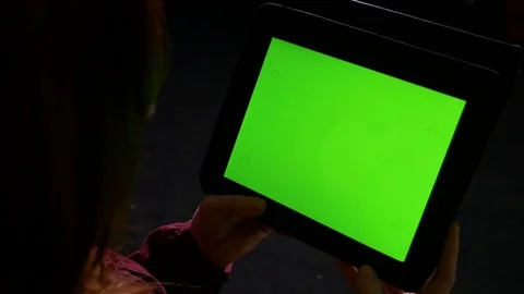 Young woman at using tablet pc late in the night and doing swipe gestures Stock Footage 74356549