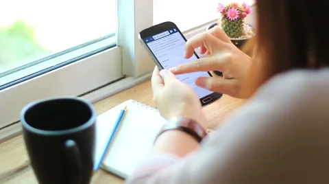 Young woman using touchscreen mobile phone. Stock-Footage 52533677