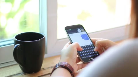 Young woman using touchscreen mobile phone. Stock Footage 52812057