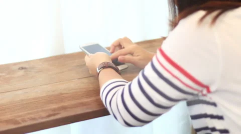 Young woman using touchscreen mobile phone. Video stock 52821445