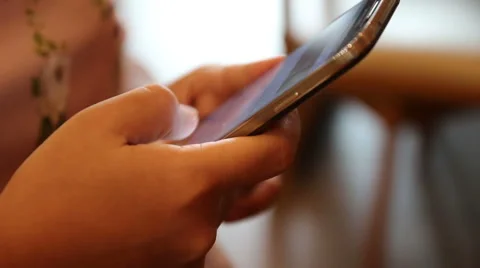 Young woman using touchscreen mobile phone. Stock-Footage 52898189