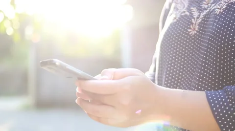 Young woman using touchscreen mobile phone. Stock Footage 63505985