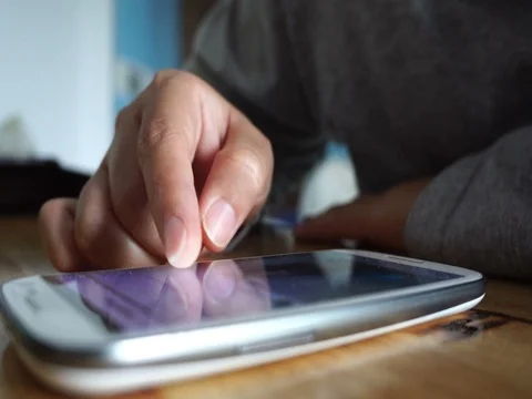 Young woman using touchscreen mobile phone. Stock Footage 71000641