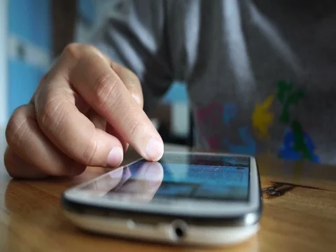 Young woman using touchscreen mobile phone. Stock Footage 71000672