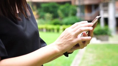 Young woman using touchscreen mobile phone. Stock Footage 78774497