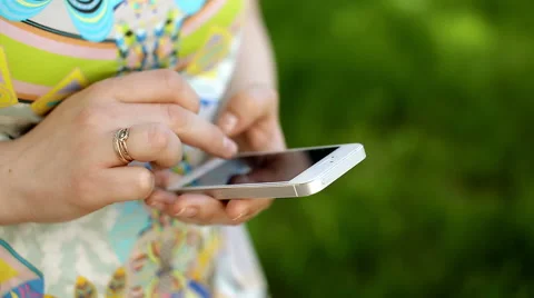 Young woman using a touchscreen of smartphone. Video stock 64450808