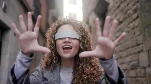 Young woman using virtual augmented reality glasses outdoor - Metaverse Stock Footage 224564780